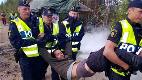 ACTIVISTS SCUFFLE WITH SWEDISH POLICE OVER MINING