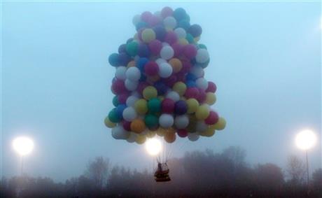 MAN USING CLUSTER BALLOONS LANDS IN NEWFOUNDLAND