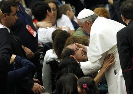 One by one, pope greets hundreds in wheelchairs