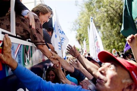 Bachelet softens reform promises before Chile vote