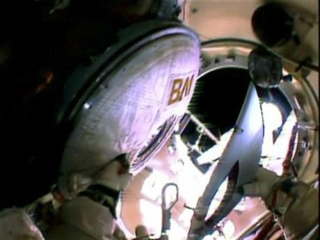 Olympic torch begins first-ever spacewalk