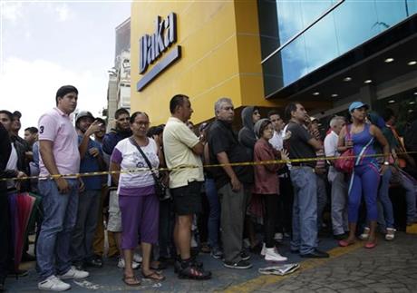 Venezuelan shoppers amass outside seized stores