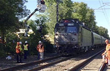 Amtrak train hits vehicle on tracks, killing 3
