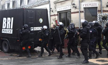 French police detain 9 in massive hunt for 2 suspects