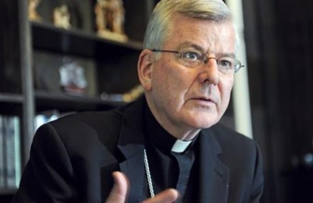 US archbishop quits after archdiocese charged with cover-up