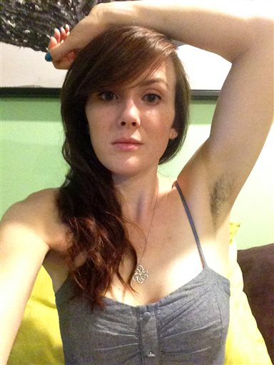 This June 12, 2015 photo released by Katherine Anne True shows True at her home in Raynham, Mass. On social media and red carpets, from New York to China, hairy underarms are having a mainstream moment. "I started it a few months ago before I knew it was a trend," said True, 30. At first, it was just for fun. Then the extra hair was met by cringes from her 5-year-old daughter and 9-year-old niece. (Katherine Anne True via AP)