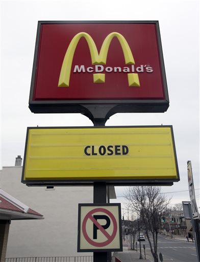 FILE - In this April 8, 2015, file photo, a seasonal McDonald's is closed for the winter in Lake George, N.Y. For the first time in more than 40 years, and perhaps ever, the number of McDonalds restaurants in the U.S. is shrinking. (AP Photo/Mike Groll, File)