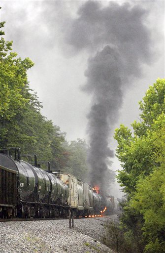 Smoke rises from a CSX train carrying flammable and toxic gas in Maryville, Tenn., Thursday, July 2, 2015. (Michael Patrick/Knoxville News Sentinel via AP)