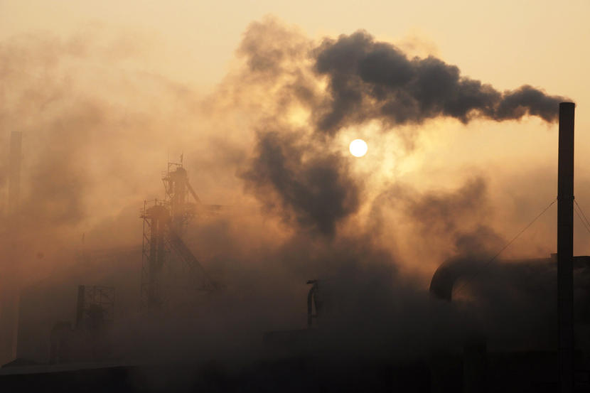 This picture taken on January 17, 2013 shows a cement factory releasing heavy smoke in Binzhou, in eastern China's Shandong province. China's economy grew at its slowest pace in 13 years in 2012, the government said on January 18, but an uptick in the final quarter pointed to better news ahead for a prime driver of the tepid global recovery.  CHINA OUT     AFP PHOTO        (Photo credit should read STR/AFP/Getty Images)