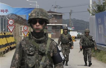 Rival Koreas restart talks, pull back from brink _ for now