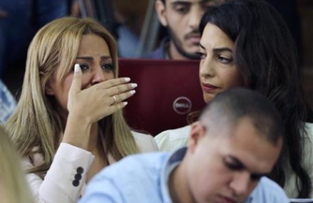 The Latest: Al-Jazeera vows to free journalists in Egypt