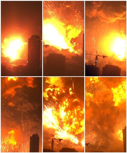 In this combination of Wednesday, Aug. 12, 2015, images taken from video provided by Dan Van Duren a warehouse explodes in Tianjin, China, as filmed from a nearby residential building. Tianjin is the world's 10th largest port.  (Dan Van Duren via AP) MANDATORY CREDIT
