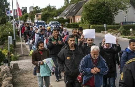 Austrian leader say accept migrants or pay