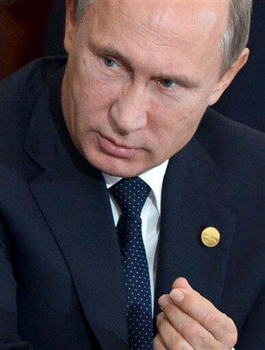 Russian President Vladimir Putin gestures while talking with First Deputy Prime Minister Igor Shuvalov during a Commonwealth of Independent States, former Soviet republics, summit in Astana, Kazakhstan, Friday, Oct. 16, 2015. Putin on Friday warned leaders of Central Asian nations of a possible militant incursion from Afghanistan. (Alexei Nikolsky, RIA-Novosti, Kremlin Pool Photo via AP)