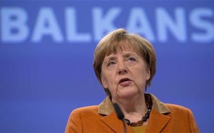 The Latest: Merkel confident Germany can integrate refugees