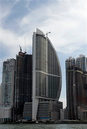 FILE - This July 4, 2011, file photo, shows the Trump Ocean Club International Hotel and Tower, third building from left, in Panama City, Panama. The tale of a 70-story waterfront tower along Panama Bay that was managed by the Trump empire offers insight into the Republican presidential candidate's business traits, and hints about the management style that might be expected from a Trump White House. (AP Photo/Arnulfo Franco)