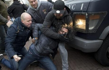 The Latest: Dutch riot police, anti-migrant protesters clash