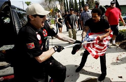 3 stabbed when violence erupts at KKK rally in California
